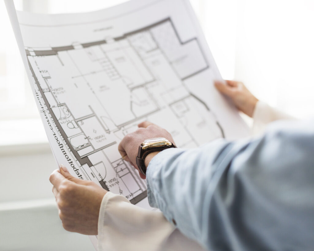 close up architect s hand discussing plan blueprint